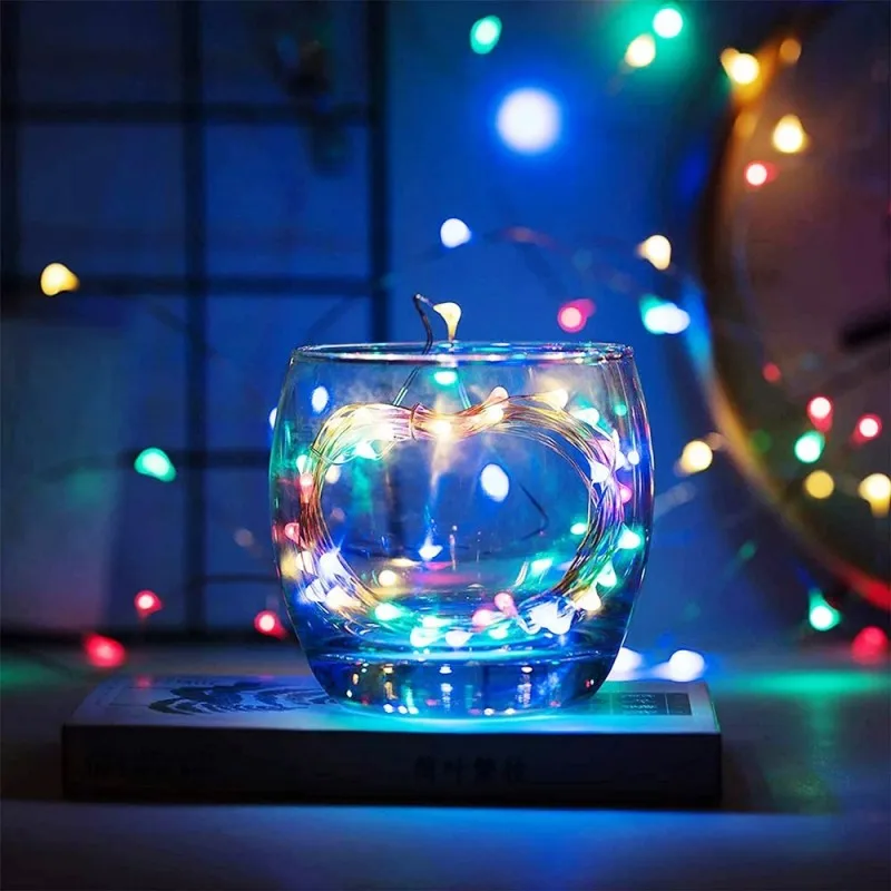 Glow fairy lights in a glass jar, perfect for enhancing table or room decorations.