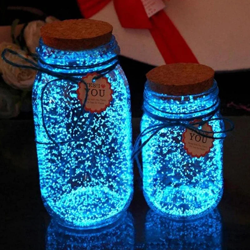 Glowing blue mason jars bring a magical touch to your Merry Grinchmas decorations.