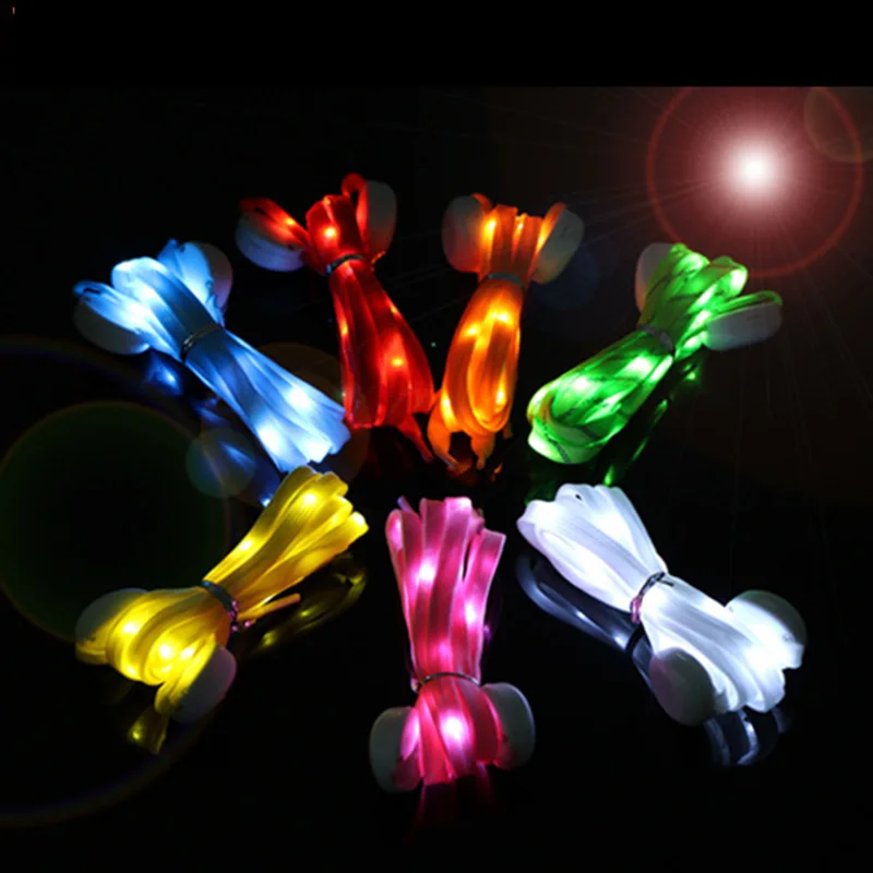 LED-lit glow stick necklaces in different colors bundled together on a dark background.